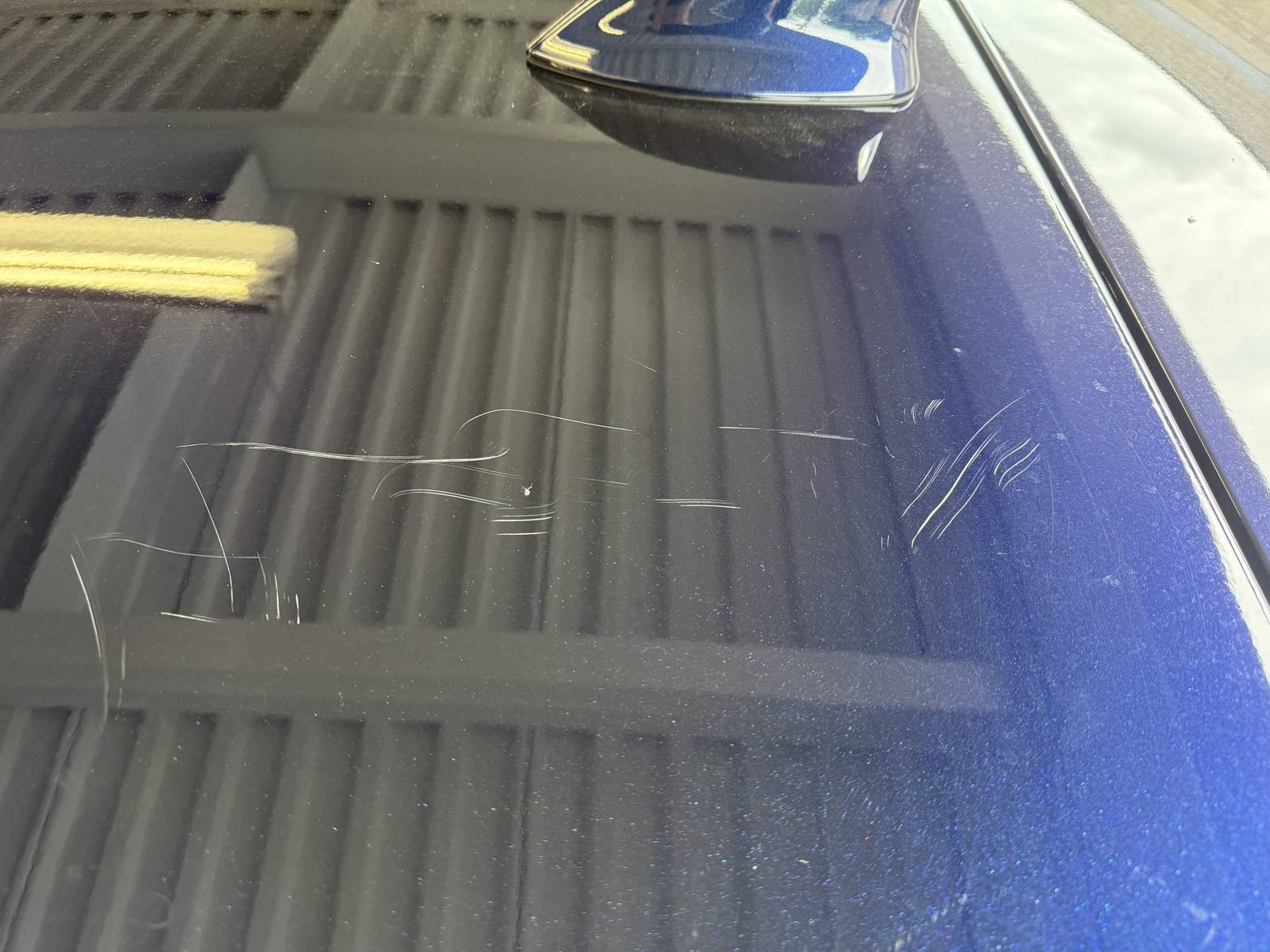 Before: scratched panel